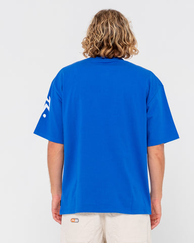 Man wearing Competition Revolution Short Sleeve Tee in Royal Blue