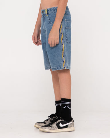 Boy wearing Flip Daddy 2.0 Jort- Middy Blue Boys in Middy Blue/lemon