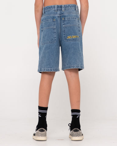 Boy wearing Flip Daddy 2.0 Jort- Middy Blue Boys in Middy Blue/lemon