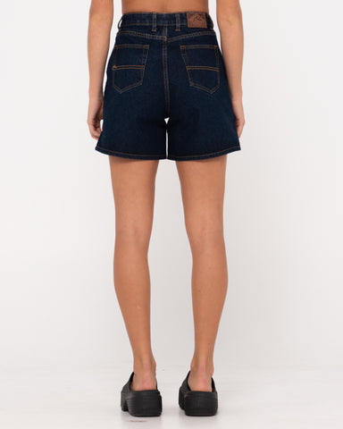 Woman wearing Cyprus High Denim Short in Deep Blue