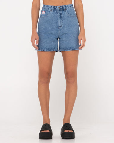 Woman wearing Cyprus High Denim Short in Middy Blue