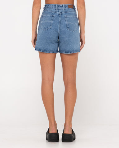 Woman wearing Cyprus High Denim Short in Middy Blue