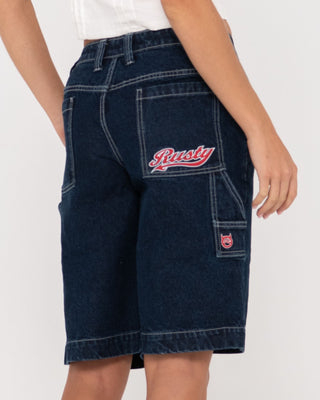 Woman wearing Billie Low Rise Carpenter Jort in Deep Blue