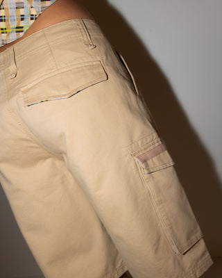 Woman wearing Tank Girl Low Rise Loose Fit Cargo Short in Oatmilk