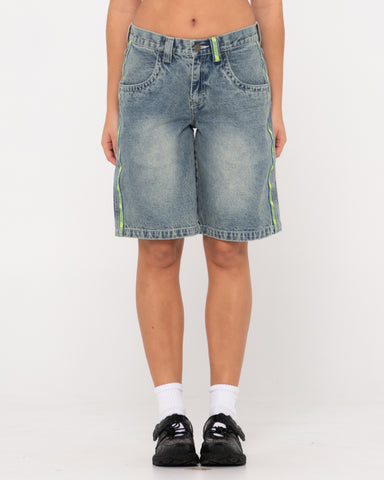 Woman wearing Flip Mommy Low Rise Wide Leg Denim Short in Dirty Dawg / Lime