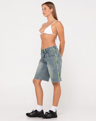 Woman wearing Flip Mommy Low Rise Wide Leg Denim Short in Dirty Dawg / Lime