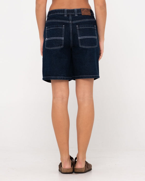 woman-wearing-high-volume-18-inch-denim-jort-in-deep-blue