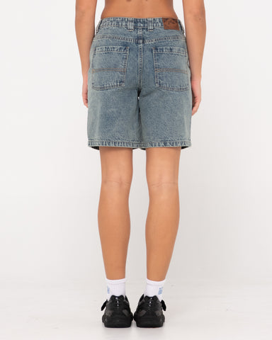 Woman wearing High Volume 18 Inch Denim Jort in Dirty Dawg