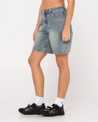 Woman wearing High Volume 18 Inch Denim Jort in Dirty Dawg