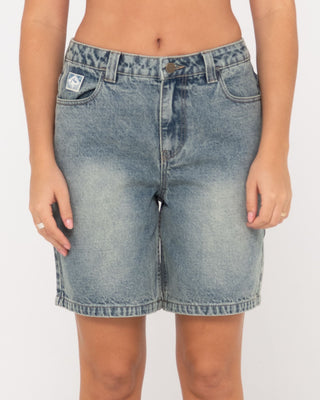 Woman wearing High Volume 18 Inch Denim Jort in Dirty Dawg