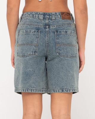 Woman wearing High Volume 18 Inch Denim Jort in Dirty Dawg