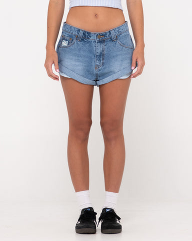 Woman wearing Pheonix Low Rise Denim Mini Short in Middy Blue