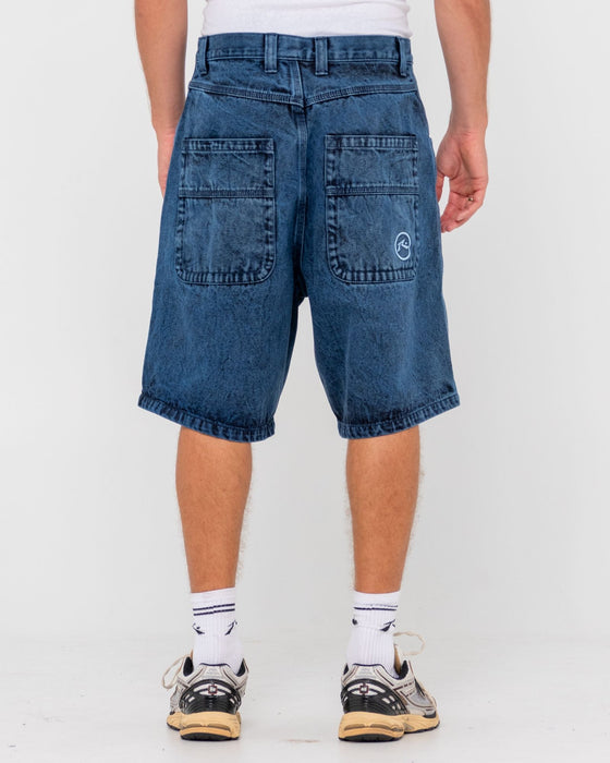man-wearing-r-dot-baggy-overdye-jort-in-blue