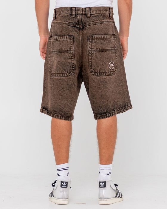 man-wearing-r-dot-baggy-overdye-jort-in-brown