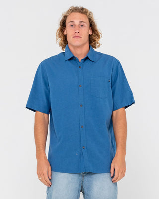 Man wearing Overtone Short Sleeve Linen Shirt in Delft Blue
