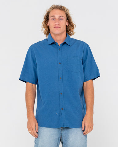 Man wearing Overtone Short Sleeve Linen Shirt in Delft Blue