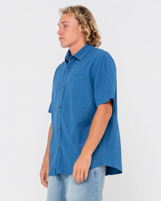 Man wearing Overtone Short Sleeve Linen Shirt in Delft Blue