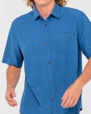 Man wearing Overtone Short Sleeve Linen Shirt in Delft Blue