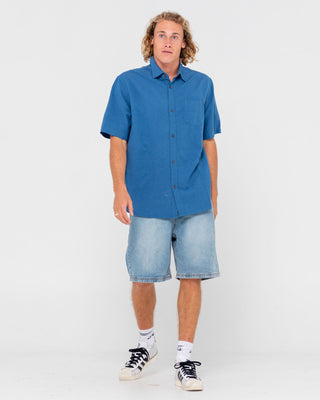 Man wearing Overtone Short Sleeve Linen Shirt in Delft Blue