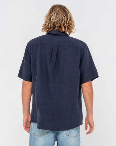 Man wearing Overtone Short Sleeve Linen Shirt in Navy Blue