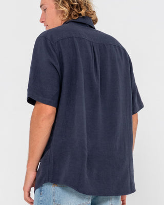 Man wearing Overtone Short Sleeve Linen Shirt in Navy Blue