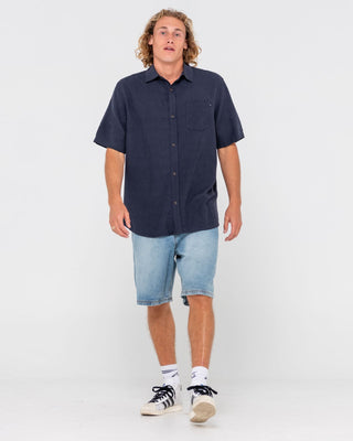 Man wearing Overtone Short Sleeve Linen Shirt in Navy Blue