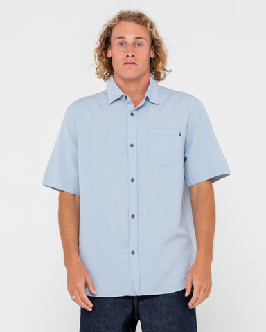 Man wearing Overtone Short Sleeve Linen Shirt in Sky Blue