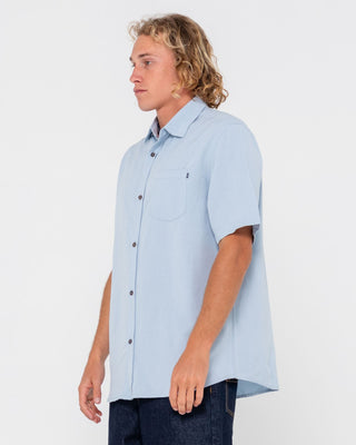 Man wearing Overtone Short Sleeve Linen Shirt in Sky Blue