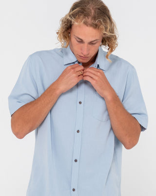 Man wearing Overtone Short Sleeve Linen Shirt in Sky Blue