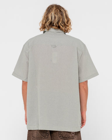 Man wearing R2k Drop Hem Short Sleeve Shirt in Oyster Grey