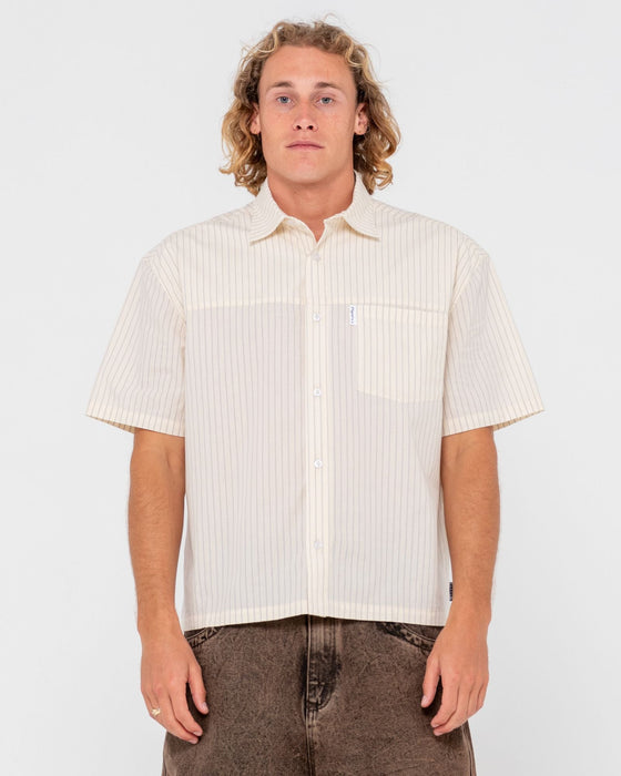 man-wearing-boxed-in-short-sleeve-shirt-in-ecru