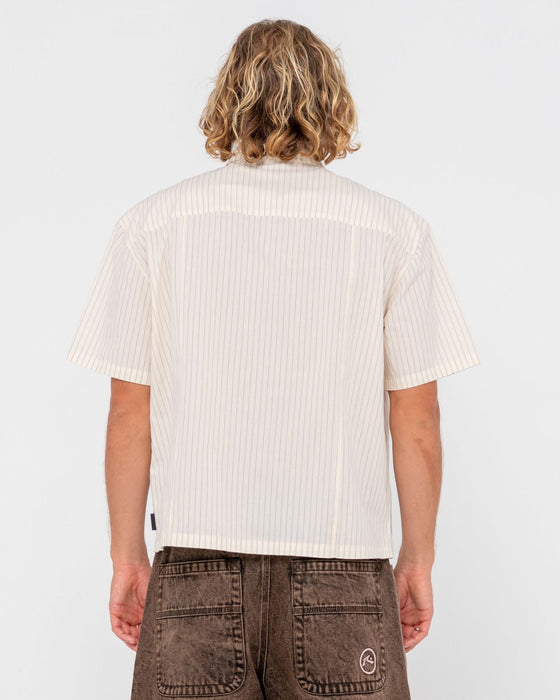 man-wearing-boxed-in-short-sleeve-shirt-in-ecru