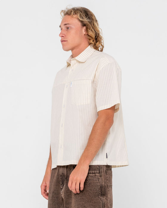 man-wearing-boxed-in-short-sleeve-shirt-in-ecru