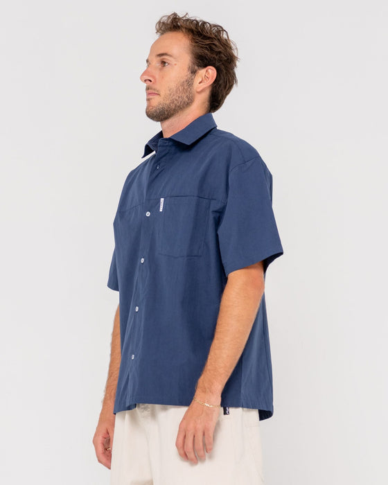 man-wearing-boxed-in-short-sleeve-shirt-in-navy-blue