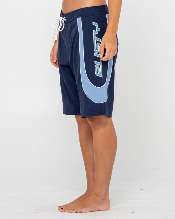 woman-wearing-charger-fixed-waist-boardshort-in-navy-blue
