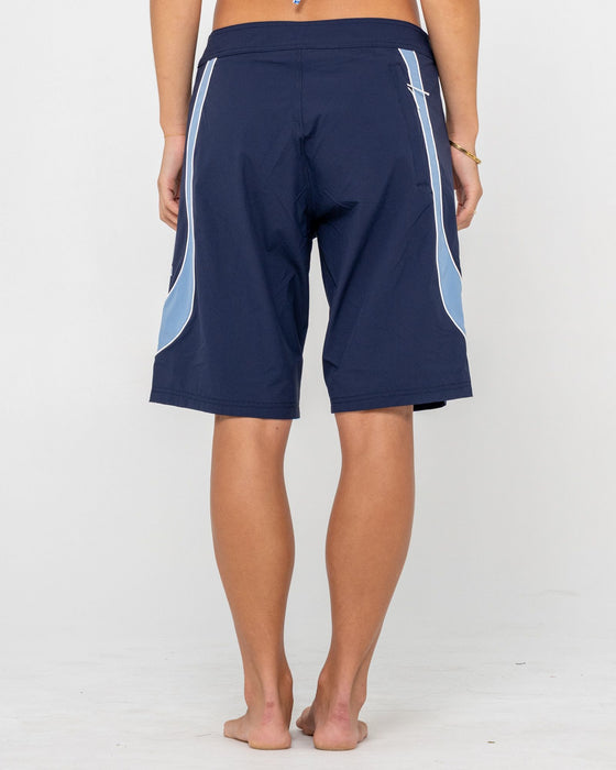 woman-wearing-charger-fixed-waist-boardshort-in-navy-blue