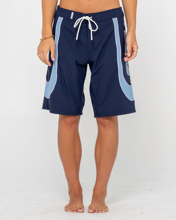 woman-wearing-charger-fixed-waist-boardshort-in-navy-blue
