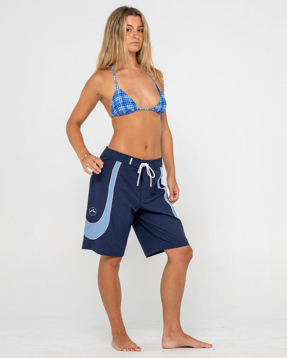 woman-wearing-charger-fixed-waist-boardshort-in-navy-blue
