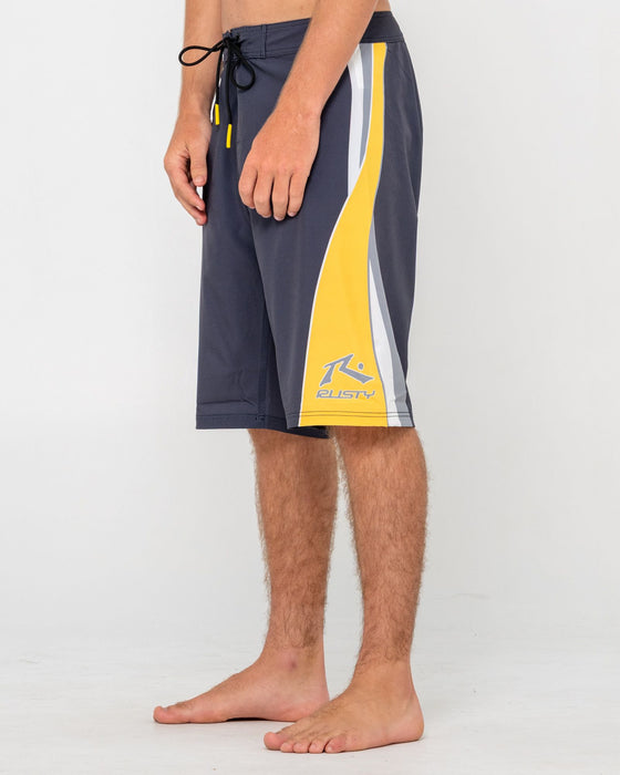 man-wearing-plot-twist-boardshort-in-coal