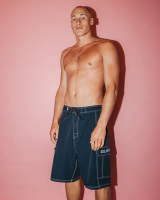 Man wearing Pick Pocket Fixed Waist Boardshort in Black 1