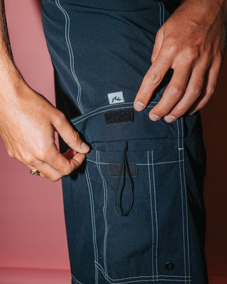 Man wearing Pick Pocket Fixed Waist Boardshort in Black 1