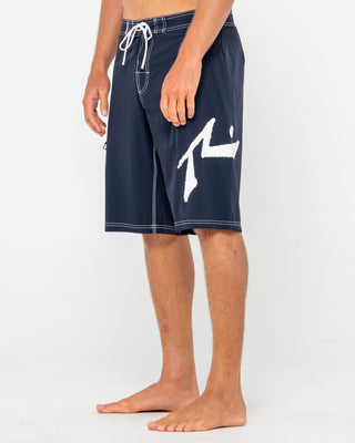 Man wearing Fixed Competition Revolution Boardshort in Navy Blue