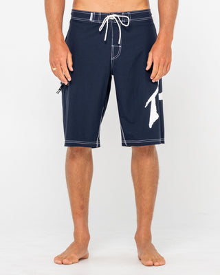 Man wearing Fixed Competition Revolution Boardshort in Navy Blue