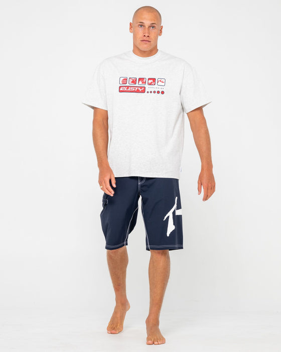 man-wearing-fixed-competition-revolution-boardshort-in-navy-blue