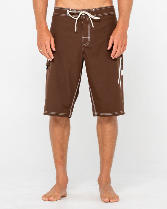 man-wearing-fixed-competition-revolution-boardshort-in-pinecone