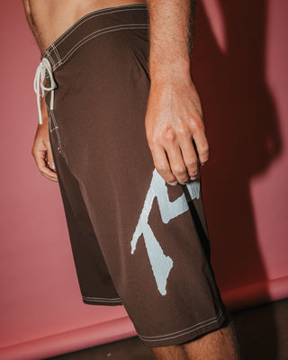 Man wearing Fixed Competition Revolution Boardshort in Pinecone