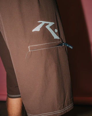 Man wearing Fixed Competition Revolution Boardshort in Pinecone