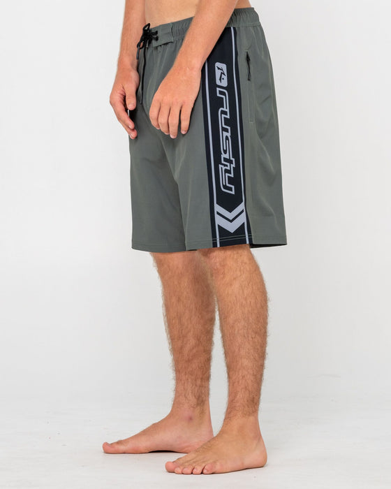 man-wearing-spitfire-hybrid-waist-boardshort-in-army-green