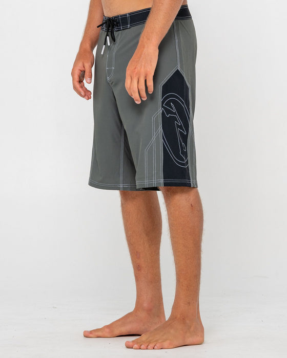 man-wearing-tombstones-fixed-waist-boardshort-in-army-green