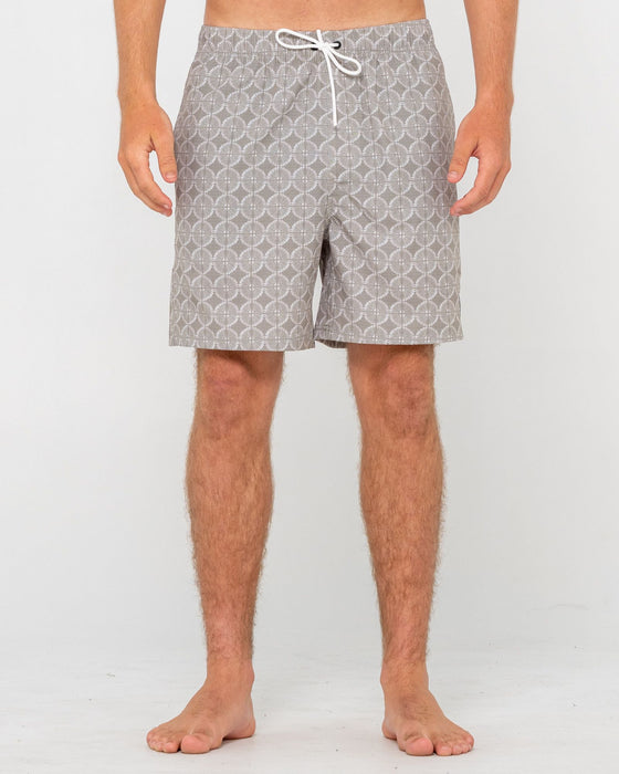 man-wearing-all-over-elastic-waist-boardshort-in-abbey-stone